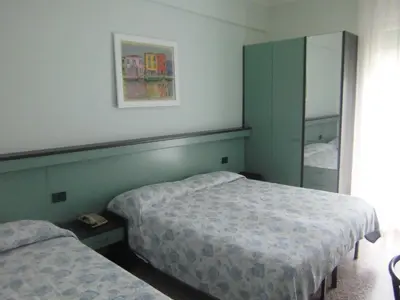 Letto o letti in una camera di Hotel Palm Beach