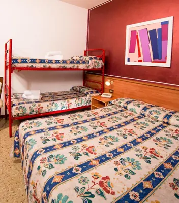 Letto o letti in una camera di Hotel Antille e Azzorre