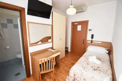 Letto o letti in una camera di Hotel Galles