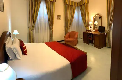 Letto o letti in una camera di Albergo Italia