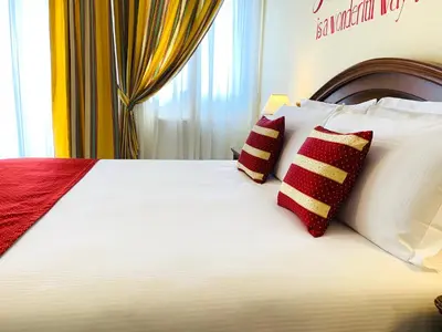 Letto o letti in una camera di Albergo Italia