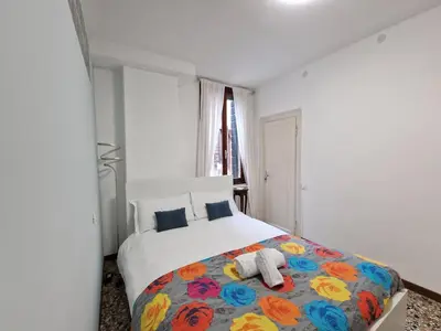 Letto o letti in una camera di Veneziacentopercento Apartments & Rooms