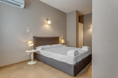 Letto o letti in una camera di JOIVY Treviso Vittoria