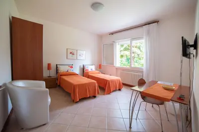 Letto o letti in una camera di B&B BrentaGiardino