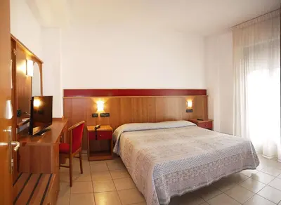 Letto o letti in una camera di Hotel Alla Rotonda