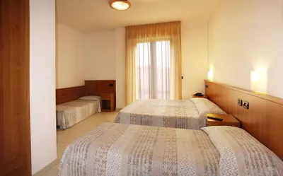 Letto o letti in una camera di Hotel Alla Rotonda