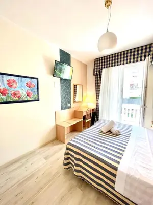 Letto o letti in una camera di Hotel Riviera