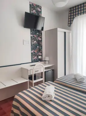 Letto o letti in una camera di Hotel Riviera