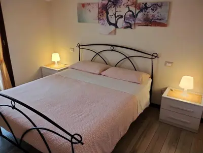 Letto o letti in una camera di Appartamento Le Rose