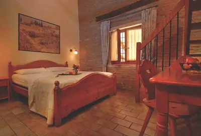 Letto o letti in una camera di Agriturismo Il Palazzone