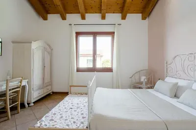 Letto o letti in una camera di Agriturismo Ai Carpini