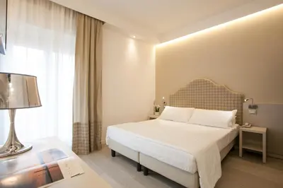 Letto o letti in una camera di Hotel Grottamare