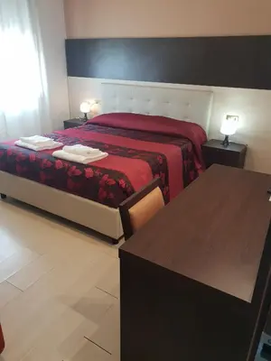 Letto o letti in una camera di Hotel Colombo