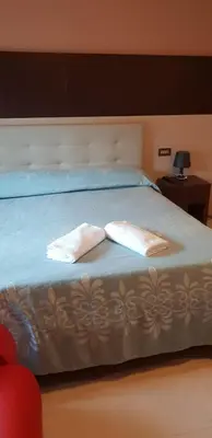 Letto o letti in una camera di Hotel Colombo