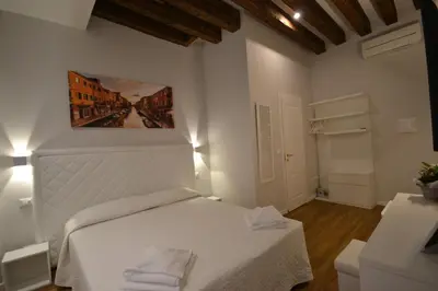 Letto o letti in una camera di Ca' Giusta