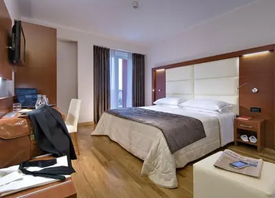 Letto o letti in una camera di Hotel Lo Zodiaco