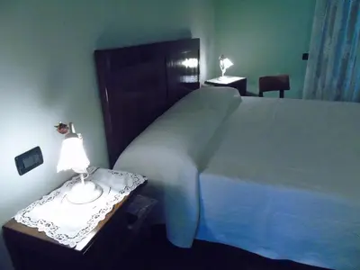 Letto o letti in una camera di B&B Ai Cipressi