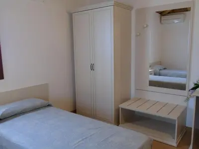 Letto o letti in una camera di B&B Ai Cipressi