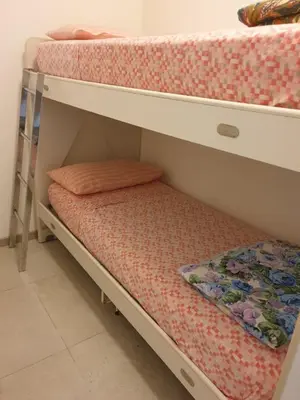 Letto o letti in una camera di residence puccini