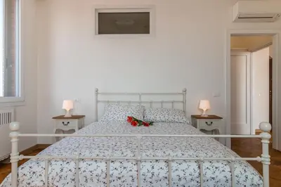 Letto o letti in una camera di PADOVA TOWER 13TH FLOOR