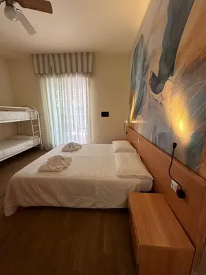 Letto o letti in una camera di Hotel La Maison