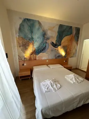 Letto o letti in una camera di Hotel La Maison