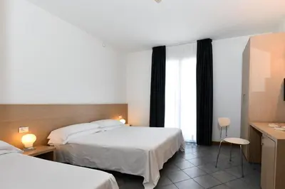 Letto o letti in una camera di Hotel Eden