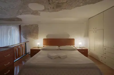 Letto o letti in una camera di Melusina Fresco Venice Historical Center