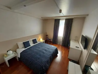 Letto o letti in una camera di Hotel Posta 77