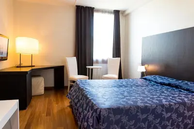 Letto o letti in una camera di Hotel Posta 77