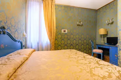 Letto o letti in una camera di Residenza Ca' San Marco