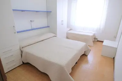 Letto o letti in una camera di Vistamare Apartments