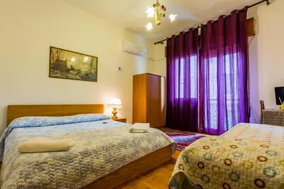 Letto o letti in una camera di The Caponi Bros