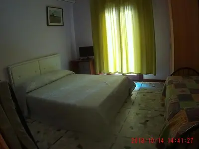 Letto o letti in una camera di The Caponi Bros