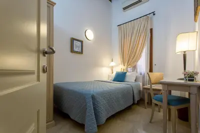 Letto o letti in una camera di Alla Vite Dorata