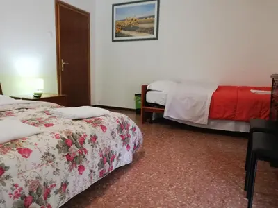 Letto o letti in una camera di Venice Concordia Guesthouse