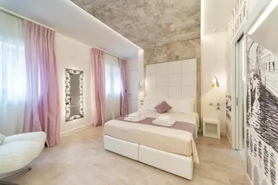 Letto o letti in una camera di Ca' de la Fonte - WENICE Deep Culture