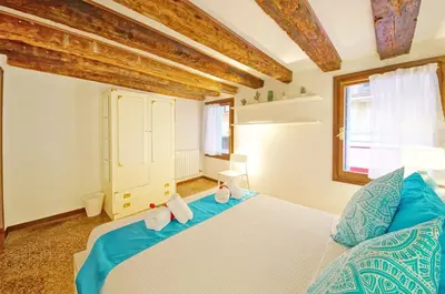 Letto o letti in una camera di Calle dei Fabbri San Marco Apartment