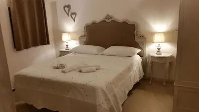 Letto o letti in una camera di La Bonbonnier