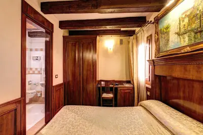 Letto o letti in una camera di Palazzo La Scala