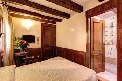 Letto o letti in una camera di Palazzo La Scala