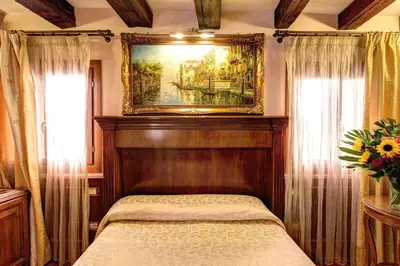 Letto o letti in una camera di Palazzo La Scala