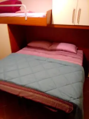 Letto o letti in una camera di condominio guanabara