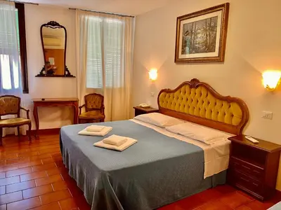 Letto o letti in una camera di Hotel Canada