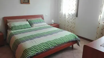 Letto o letti in una camera di Roberta