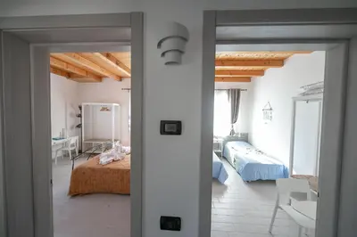 Letto o letti in una camera di Casa Lagunare