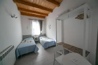 Letto o letti in una camera di Casa Lagunare