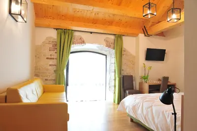 Letto o letti in una camera di NUOVA FILANDA Rooms and More