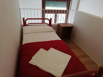 Letto o letti in una camera di Ostello S. Fosca - CPU Venice Hostels