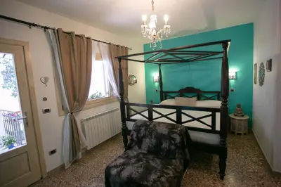 Letto o letti in una camera di B&B La Corte